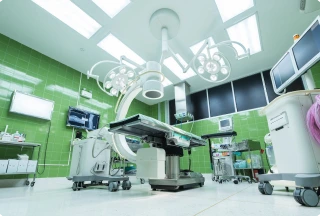 Empty operating room with surgical bed, lights, carts, and monitoring devices, symbolizing changes in healthcare roles and scope of practice.